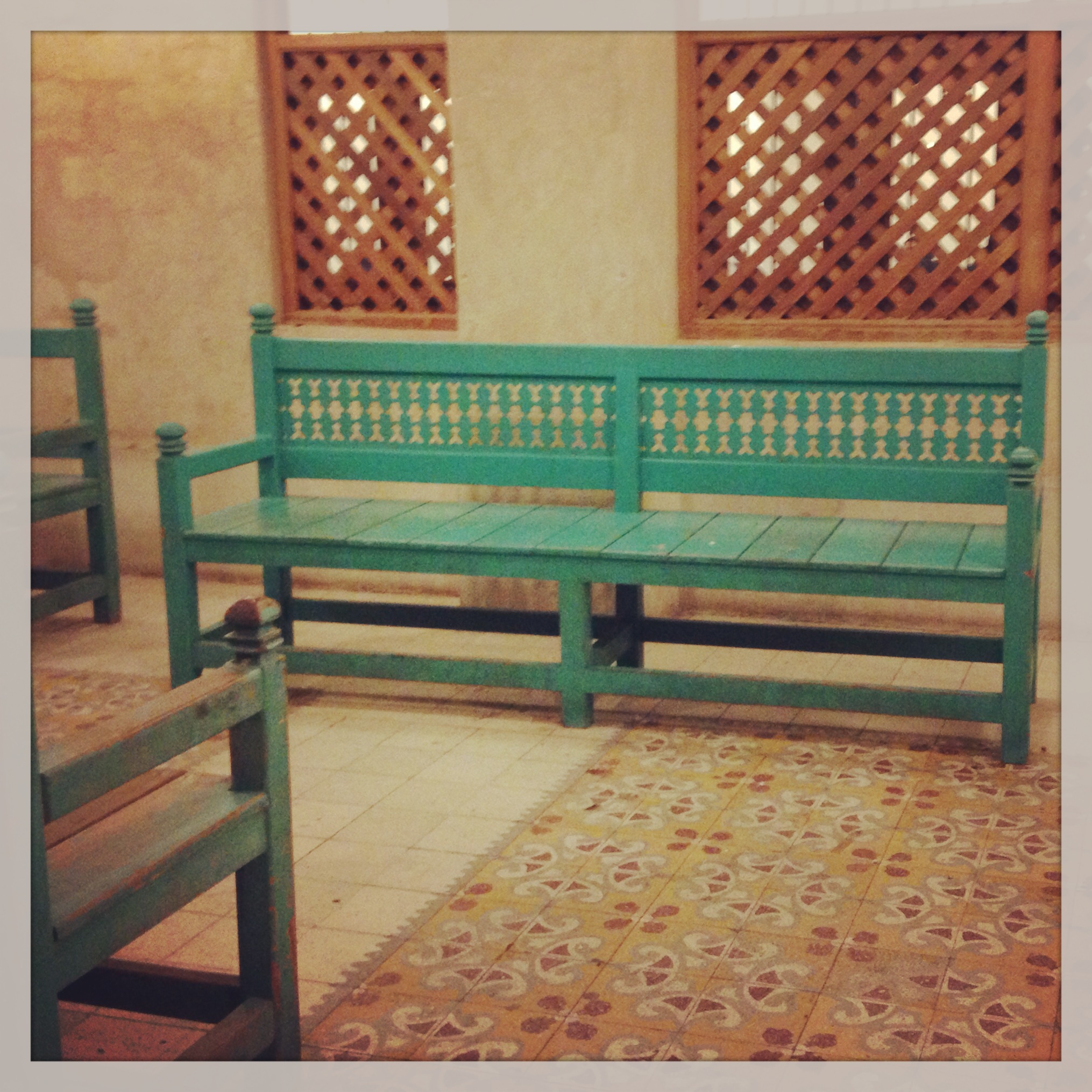 green bench at the souq